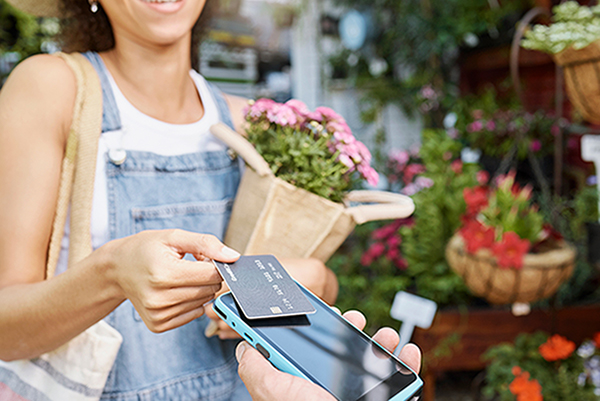 lady paying with credit card using mobile device